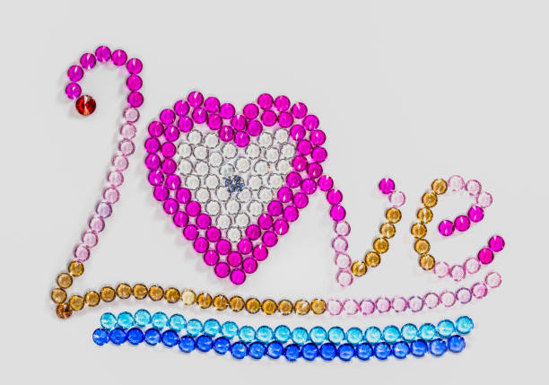 the word Love written by colorful diamonds in white background for valentine day