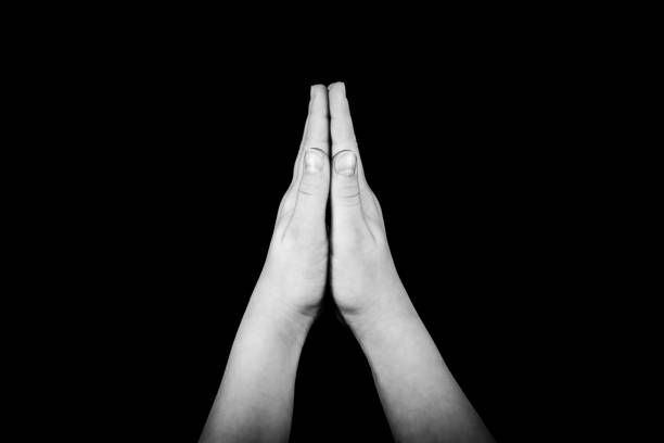 istock photo of praying hands. 905684270