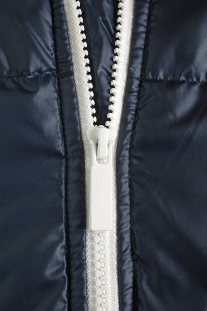 istock Closeup of white zipper in jacket 905687574