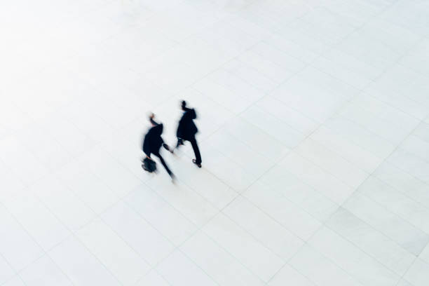 Overhead view of two businessman walking