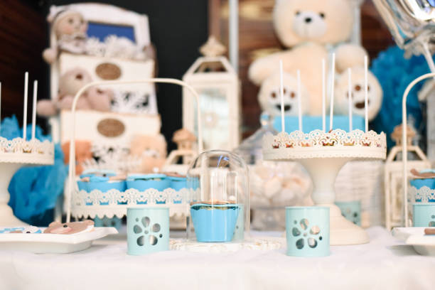 istock Sweet table and delicious cakes for first birthday 905689930