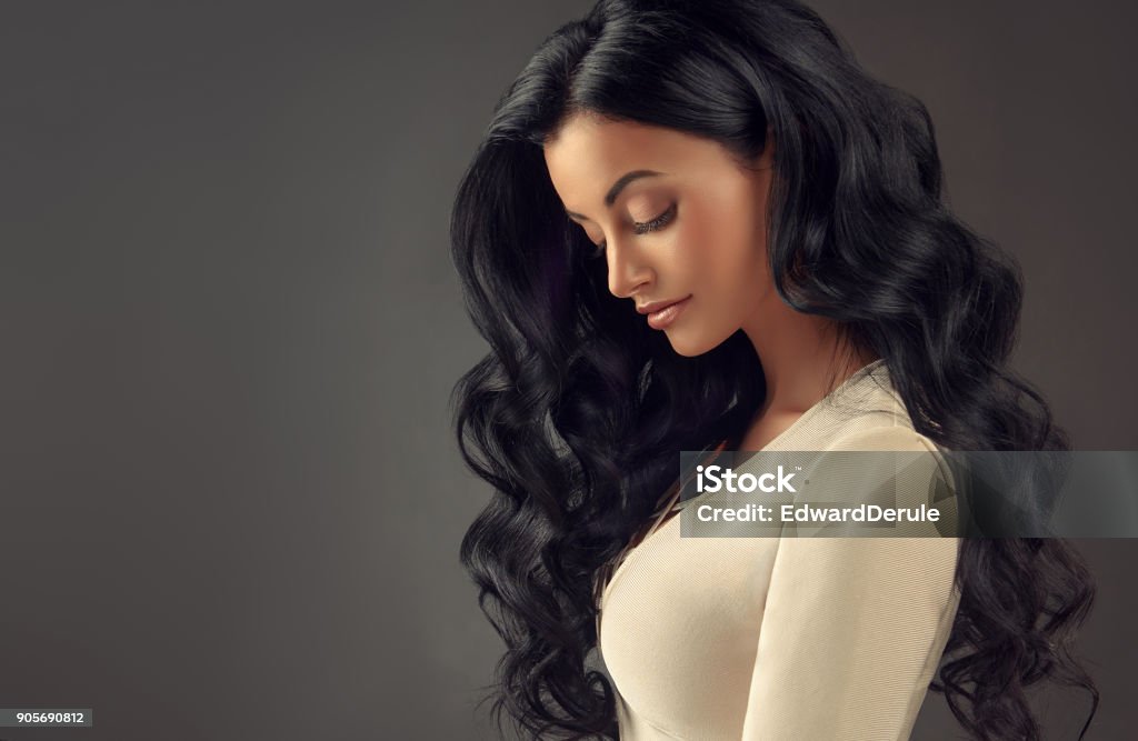 Black Haired Woman With Voluminous Shiny And Curly Hairstylefrizzy Hair  Stock Photo - Download Image Now - iStock