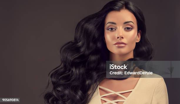 Black Haired Woman With Voluminous Shiny And Curly Hairstylefrizzy Hair Stock Photo - Download Image Now