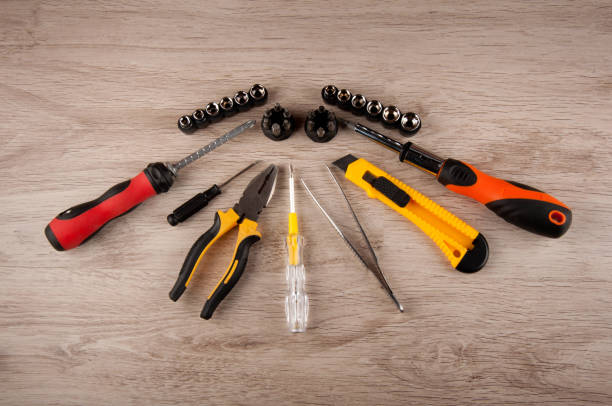 istock various types of tools with screws on a wooden table 905691646