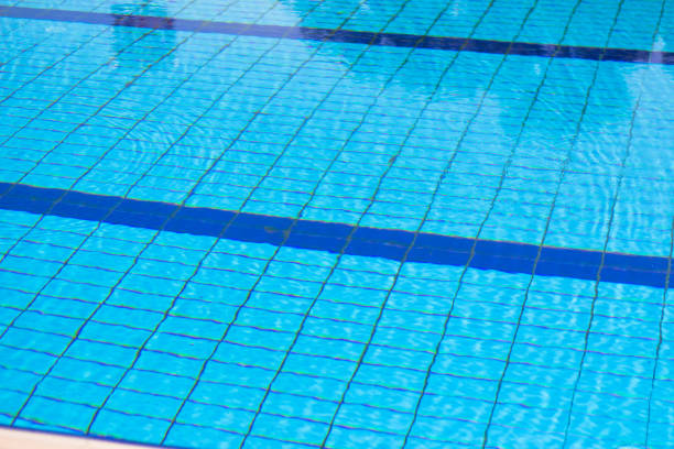 istock Surface of swimming pool outdoor. 905694590