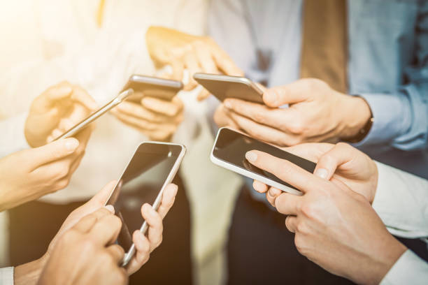 istock Friends having fun together with smartphones. 905694644