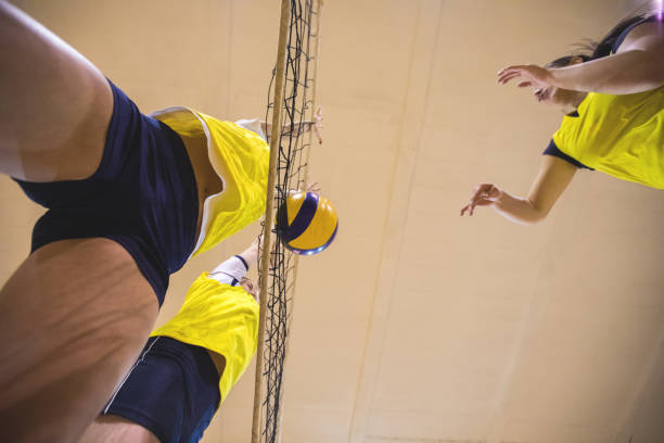 istock Low angle view of Female volleyball attack 905698828