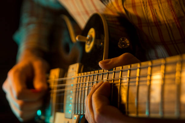 istock Play the electic guitar, close up 905699308