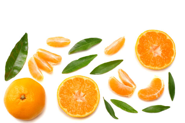 istock mandarin with slices and green leaf isolated on white background top view 905709718