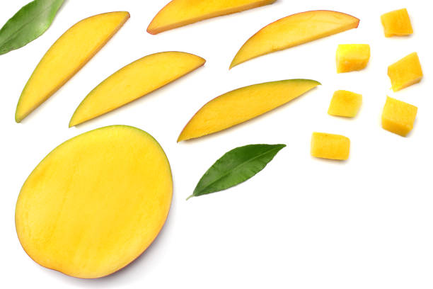istock mango slice with green leaves isolated on white background. top view 905709744