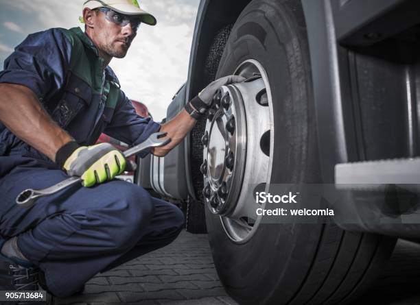 Semi Truck Wheel Maintenance Stock Photo - Download Image Now - Truck, Mechanic, Tire - Vehicle Part