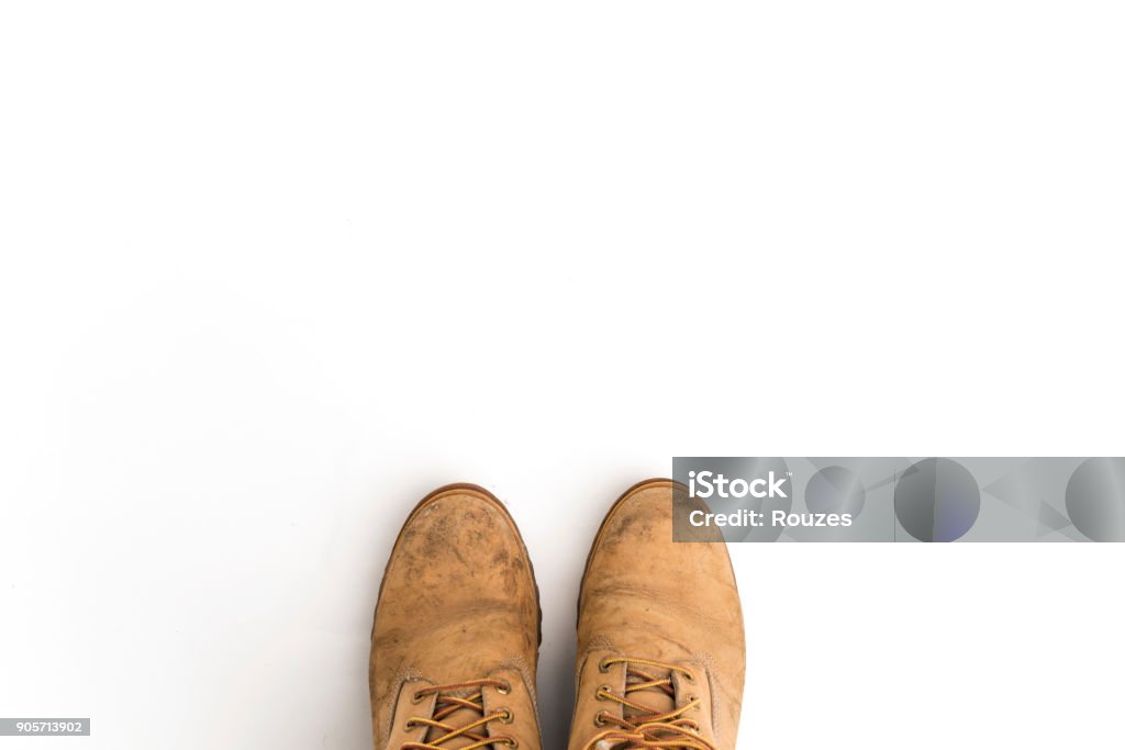 construction boots isolated Close-up top view of construction safety shoe on white Boot Stock Photo
