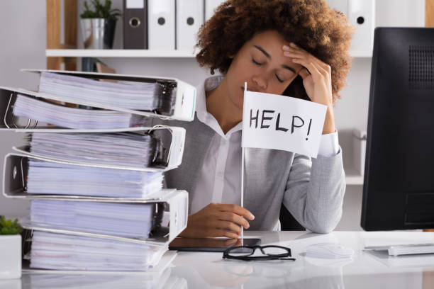 istock Businesswoman Holding White Help Flag In Office 905715468
