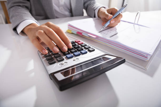istock Businessperson Calculating Bills In Office 905715494