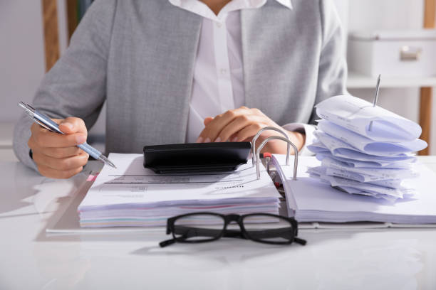istock Businessperson Calculating Bills In Office 905715516