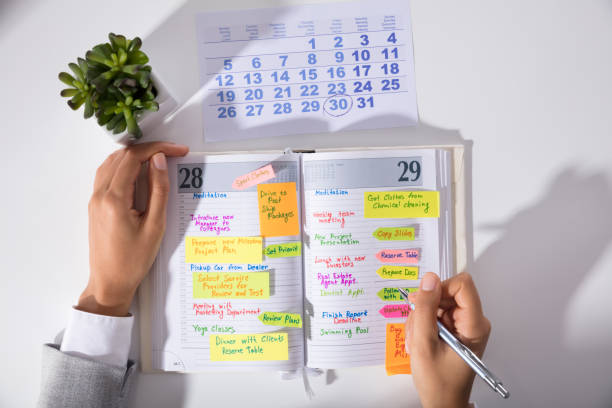 istock Businesswoman Hand's With Calendar Writing Schedule In Diary 905715550