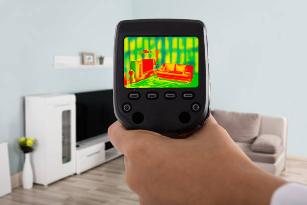 Person Hand Using Infrared Thermal Camera In Living Room