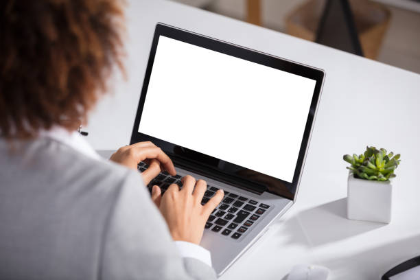 istock Businesswoman Working On Laptop With Blank Screen 905715680