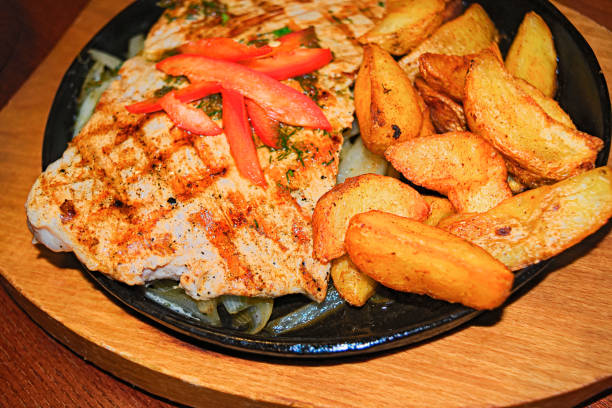 istock Grilled steaks with fries 905715868