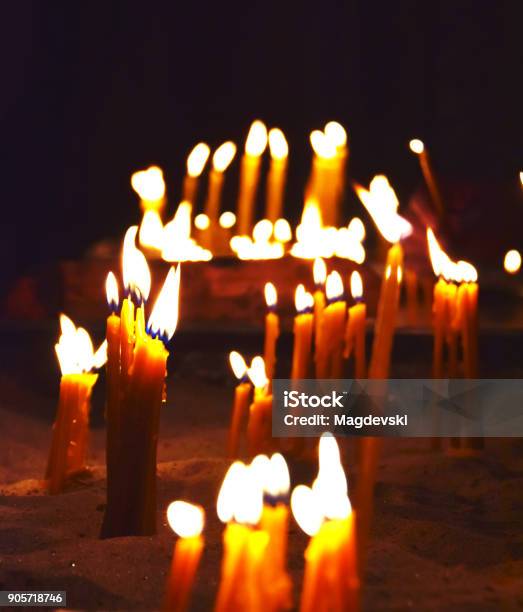 Burning Candles On A Candle Stand In The Church Stock Photo - Download Image Now - Ancient, Atmospheric Mood, Backgrounds