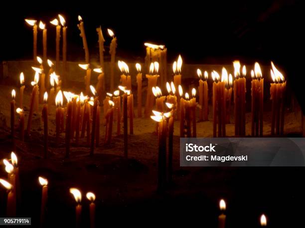 Burning Candles In A Sand On A Candle Stand In The Church Stock Photo - Download Image Now