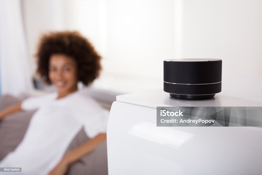 Close-up Of Wireless Speaker Close-up Of Black Wireless Speaker On Furniture Assistant Stock Photo