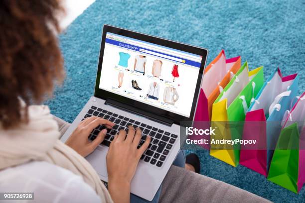 Woman Shopping Online On Laptop Stock Photo - Download Image Now - Adult, Apartment, Bag