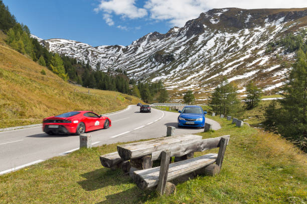 Grossglockner High Alpine Road mountain landscape with luxury sport cars in Austrian Alps. It is the highest surfaced mountain pass road in Austria.