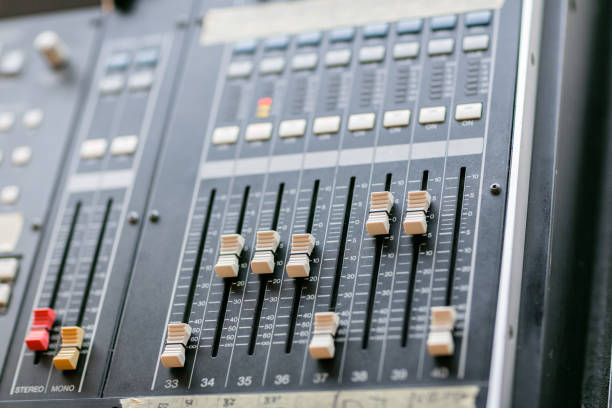 istock Music mixer equalizer console for mixer control sound device. Sound technician audio mixer equalizer control. Mastering For Radio and TV Broadcast. 905727934
