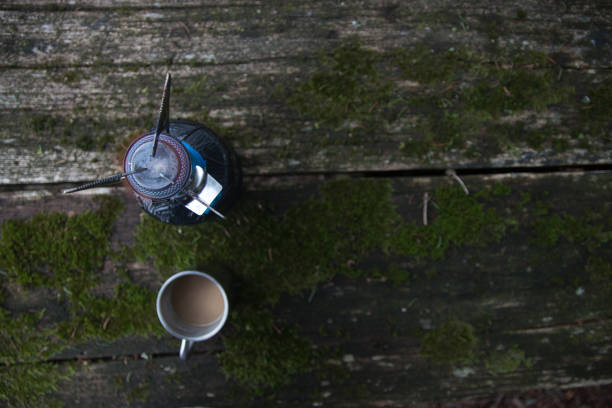 istock Coffee cup, and camping stove top view with copy space 905727942