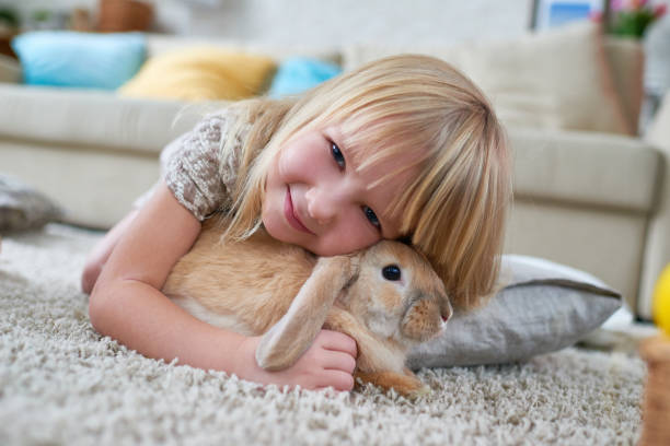 istock Smiling cute girl with Easter bunny 905728008