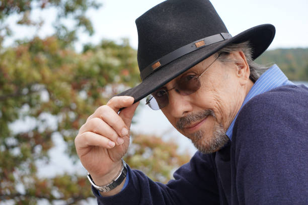 istock Man in the woods with hat 905739888