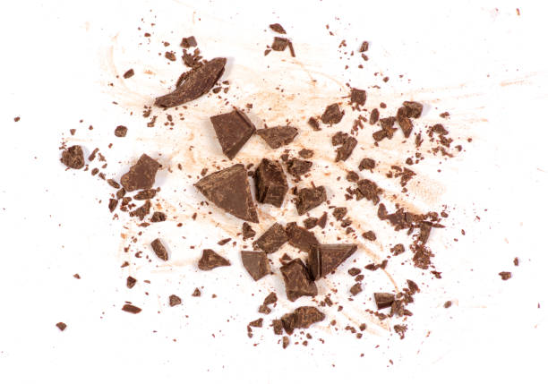 istock Pile chopped, milled chocolate isolated on white background 905742286