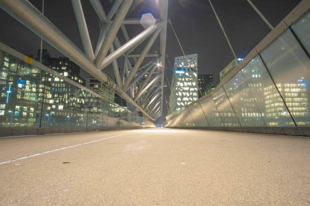 istock Akrobaten pedestrian bridge at night 905742962