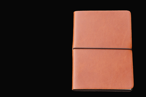 Notebook business acessory cover leather on black background