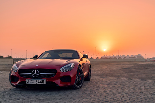 28th December 2017 - Abu Dhabi, UAE. Red Mercedes SLS GTs in front of a beautiful sunset.
