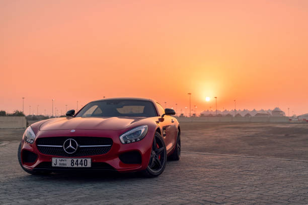 Mercedes SLS GTs amg Sunset 28th December 2017 - Abu Dhabi, UAE. Red Mercedes SLS GTs in front of a beautiful sunset. mercedes benz photos stock pictures, royalty-free photos & images