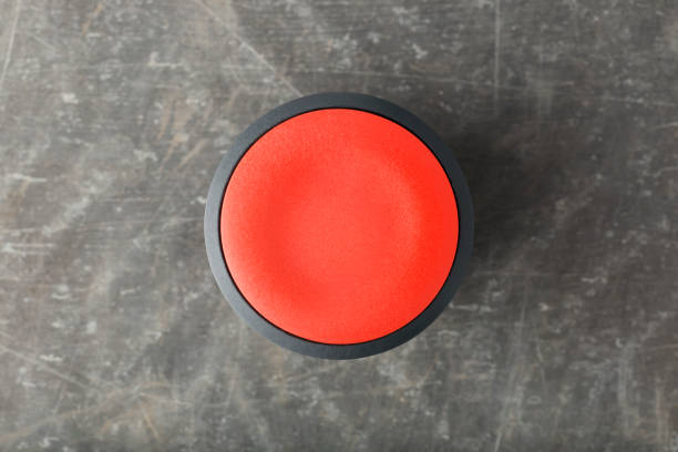 istock Overhead of Red Circular Push Button on Smooth Concrete 905753790