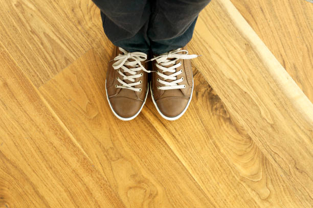 istock Man Standing On The Wooden Floor 905754910