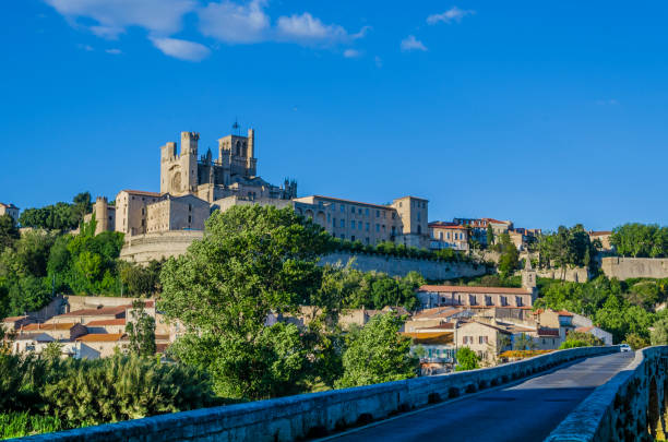 Panoramic of the city of Beziers France On the banks of the river Orb in the French region of the Languedoc is erected one the oldest cities of Europe, Beziers. The dome of the roman-gothic cathedral of Saint-Nazarie stands out from the rest of the city. beziers stock pictures, royalty-free photos & images
