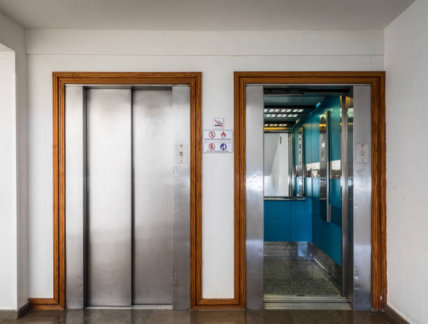 istock Open and closed chrome metal hotel building elevator doors realistic photo. 905757670