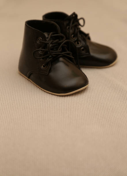 istock Black leather baby shoes 905760908