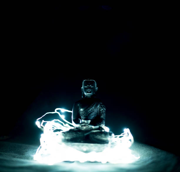 istock Buddha statue on a seat of lights 905761400