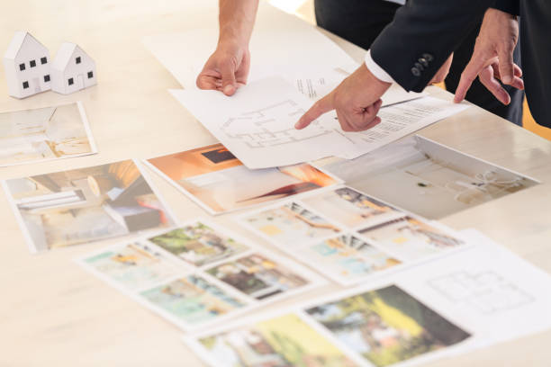 istock Real estate consultant presenting offers 905763906