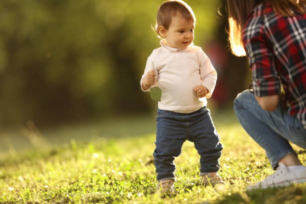 istock Playful baby in the park 905768584