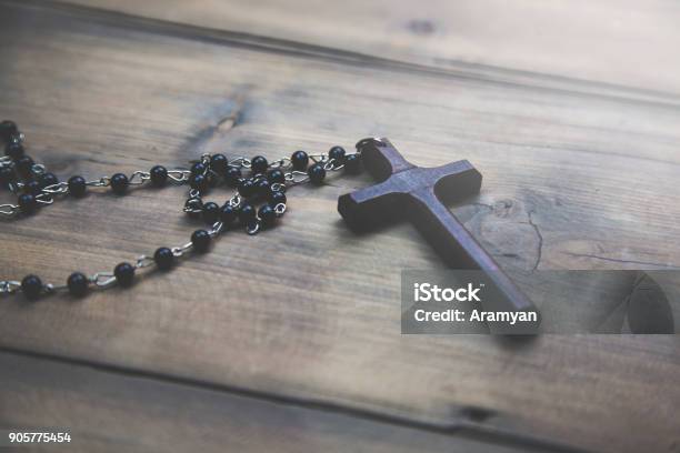 Cross On The Wooden Table Stock Photo - Download Image Now - Catholicism, Christianity, Church