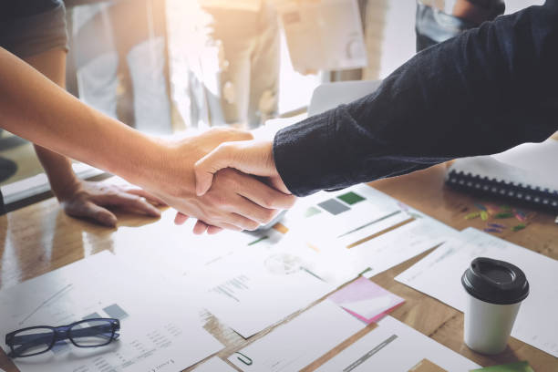 Business Partnership concept. business man shaking hands during a meeting in the office, success, dealing, greeting. Business Partnership concept. business man shaking hands during a meeting in the office, success, dealing, greeting. casual handshake stock pictures, royalty-free photos & images