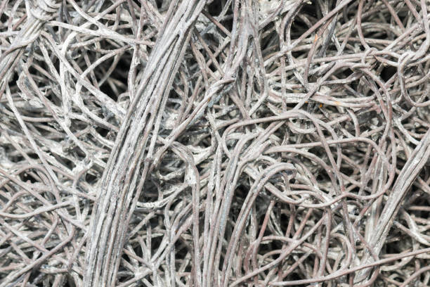 istock tangled strands of silver wire on black background 905785120