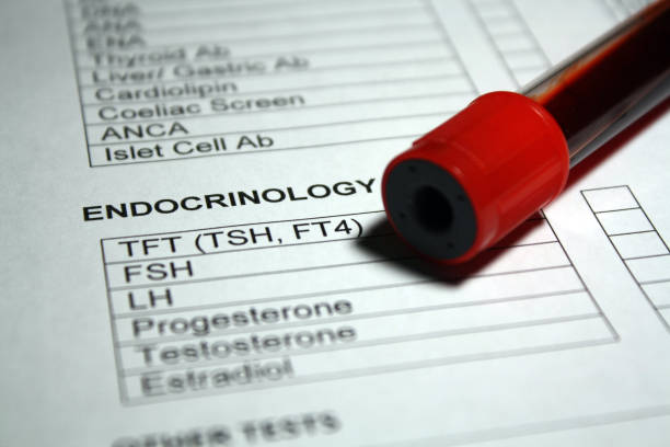 Endocrinology Blood Work Vacutainer blood collection tube with blood work requisition document. estrogen photos stock pictures, royalty-free photos & images