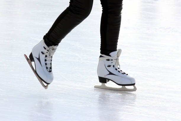 istock foot ice-skating people on the ice rink 905791984